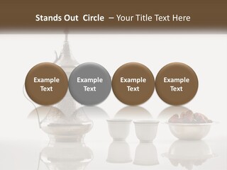 A Silver Tea Pot And Cups On A Table PowerPoint Template