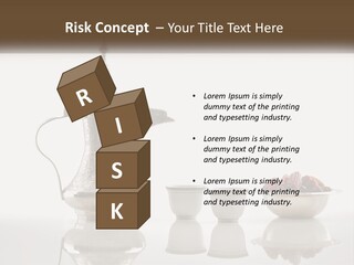 A Silver Tea Pot And Cups On A Table PowerPoint Template