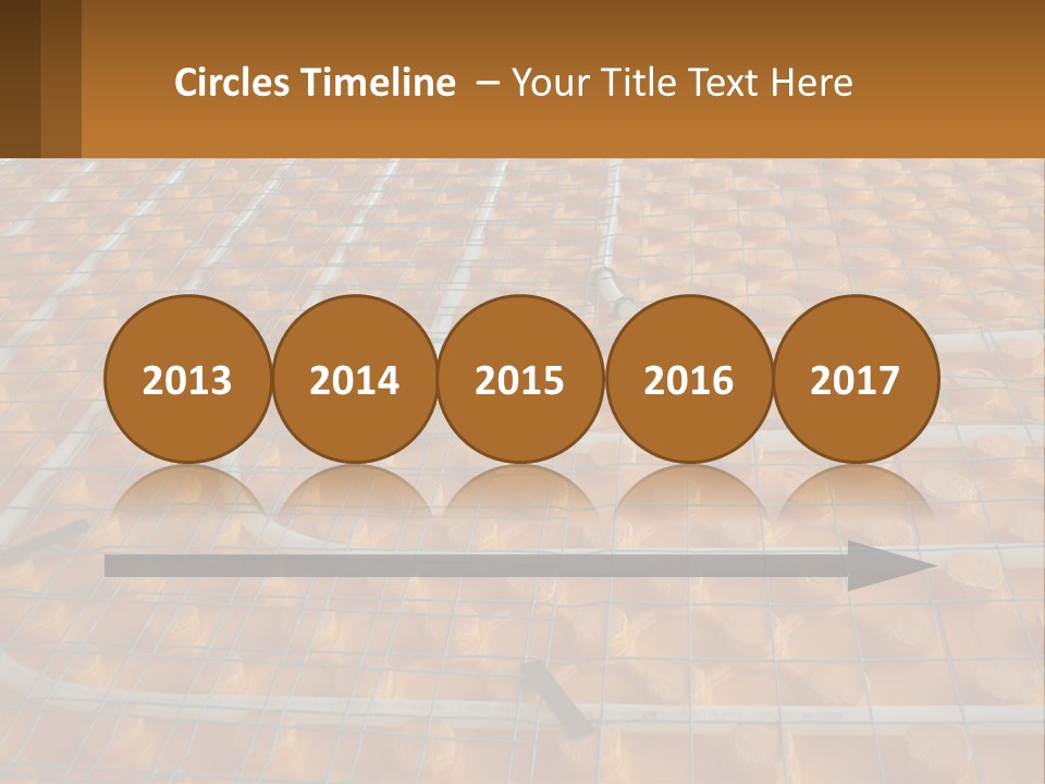 A Group Of Oranges Sitting On Top Of A Conveyor Belt PowerPoint Template