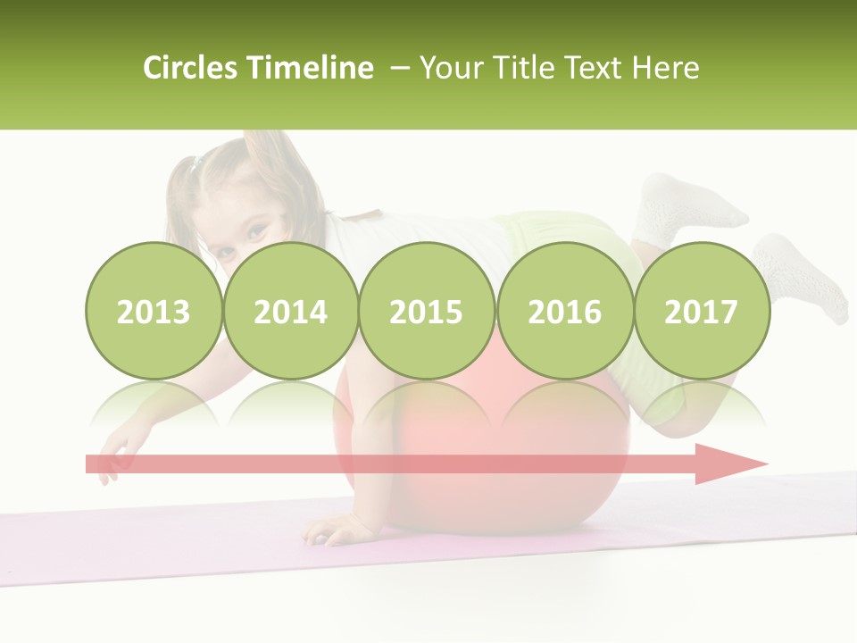 A Little Girl Is Laying On Top Of A Ball PowerPoint Template