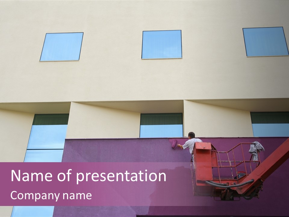 A Man Is Painting The Side Of A Building PowerPoint Template