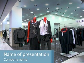Two Mannequins Dressed In Black And White In A Clothing Store PowerPoint Template