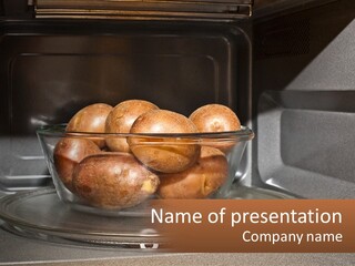 A Glass Bowl Filled With Apples On Top Of A Stove PowerPoint Template