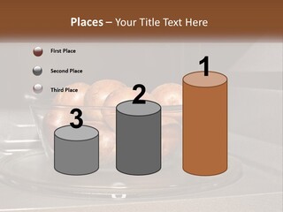 A Glass Bowl Filled With Apples On Top Of A Stove PowerPoint Template