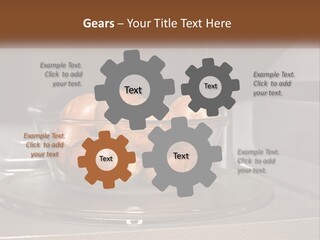 A Glass Bowl Filled With Apples On Top Of A Stove PowerPoint Template