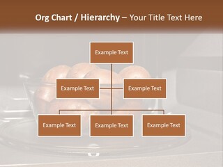 A Glass Bowl Filled With Apples On Top Of A Stove PowerPoint Template