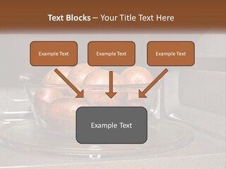 A Glass Bowl Filled With Apples On Top Of A Stove PowerPoint Template