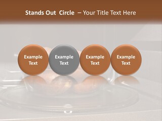 A Glass Bowl Filled With Apples On Top Of A Stove PowerPoint Template