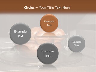 A Glass Bowl Filled With Apples On Top Of A Stove PowerPoint Template