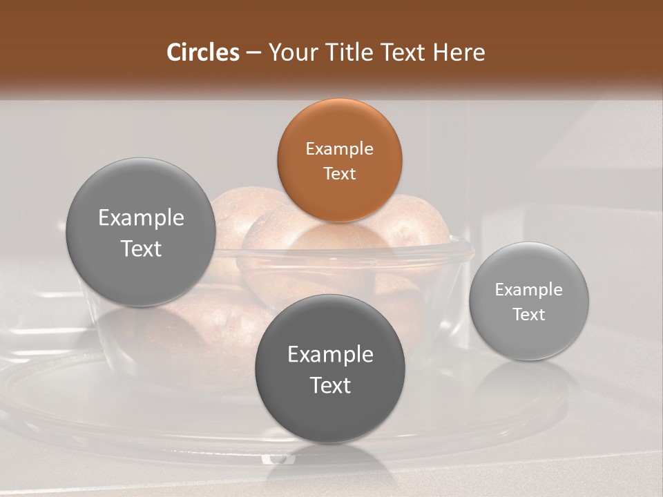 A Glass Bowl Filled With Apples On Top Of A Stove PowerPoint Template