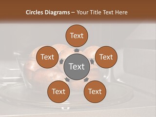 A Glass Bowl Filled With Apples On Top Of A Stove PowerPoint Template
