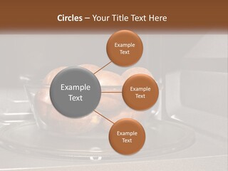 A Glass Bowl Filled With Apples On Top Of A Stove PowerPoint Template