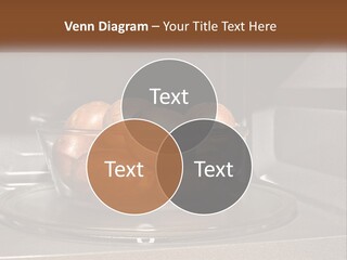 A Glass Bowl Filled With Apples On Top Of A Stove PowerPoint Template