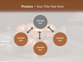 A Glass Bowl Filled With Apples On Top Of A Stove PowerPoint Template