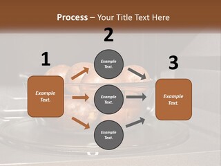 A Glass Bowl Filled With Apples On Top Of A Stove PowerPoint Template