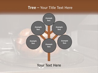 A Glass Bowl Filled With Apples On Top Of A Stove PowerPoint Template