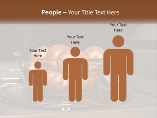 A Glass Bowl Filled With Apples On Top Of A Stove PowerPoint Template
