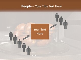 A Glass Bowl Filled With Apples On Top Of A Stove PowerPoint Template