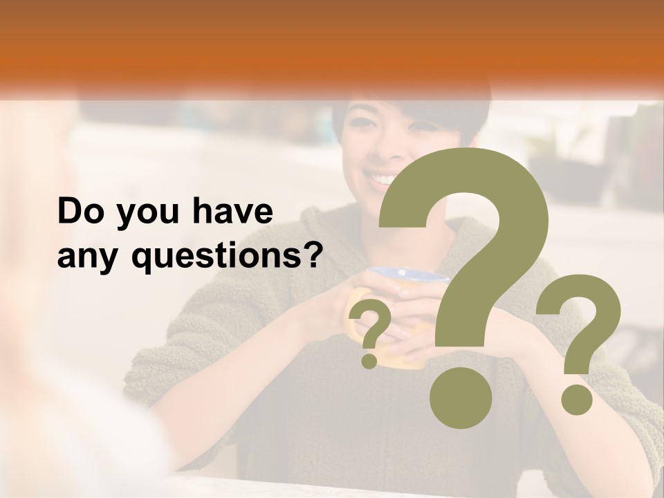 A Woman Sitting At A Table With A Cup In Her Hands PowerPoint Template