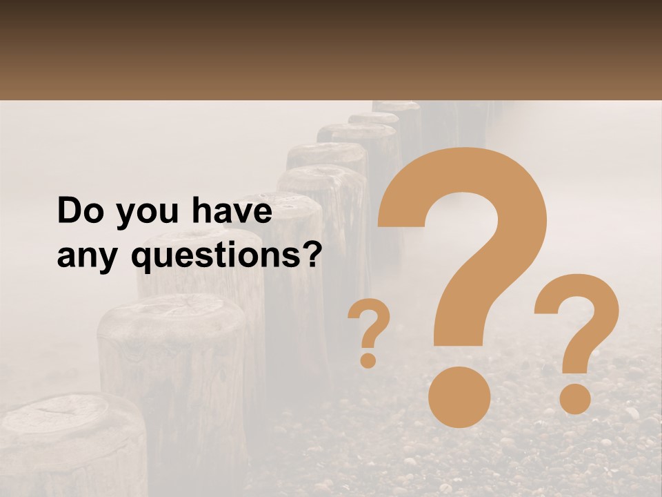 A Row Of Wooden Logs Sitting On Top Of A Beach PowerPoint Template