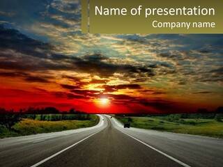 A Road With A Sunset In The Background PowerPoint Template