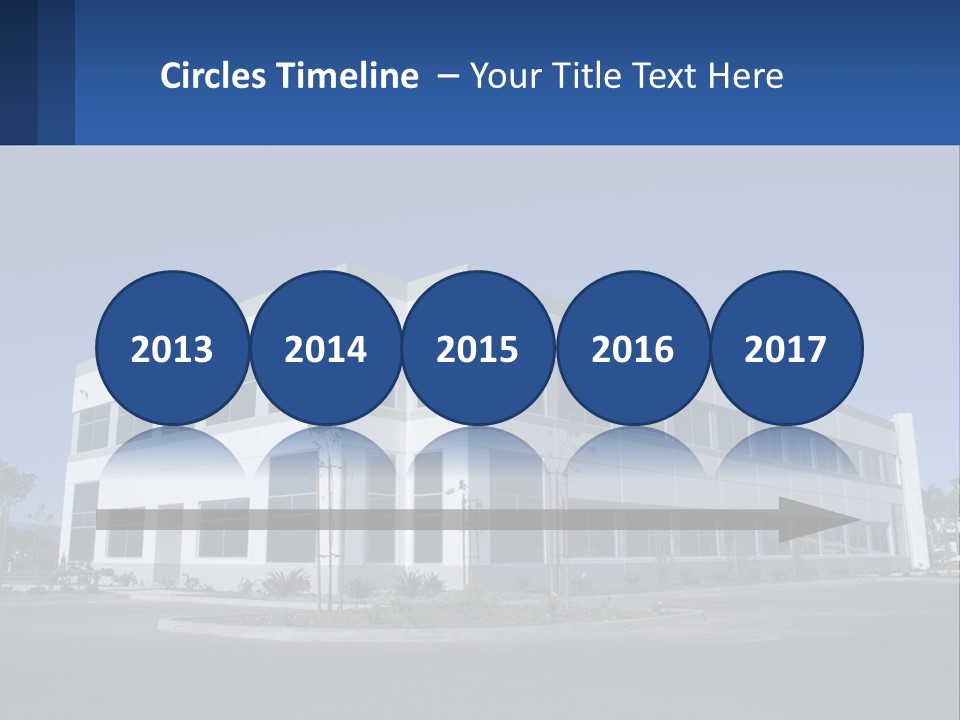 A Large White Building With A Blue Sign In Front Of It PowerPoint Template