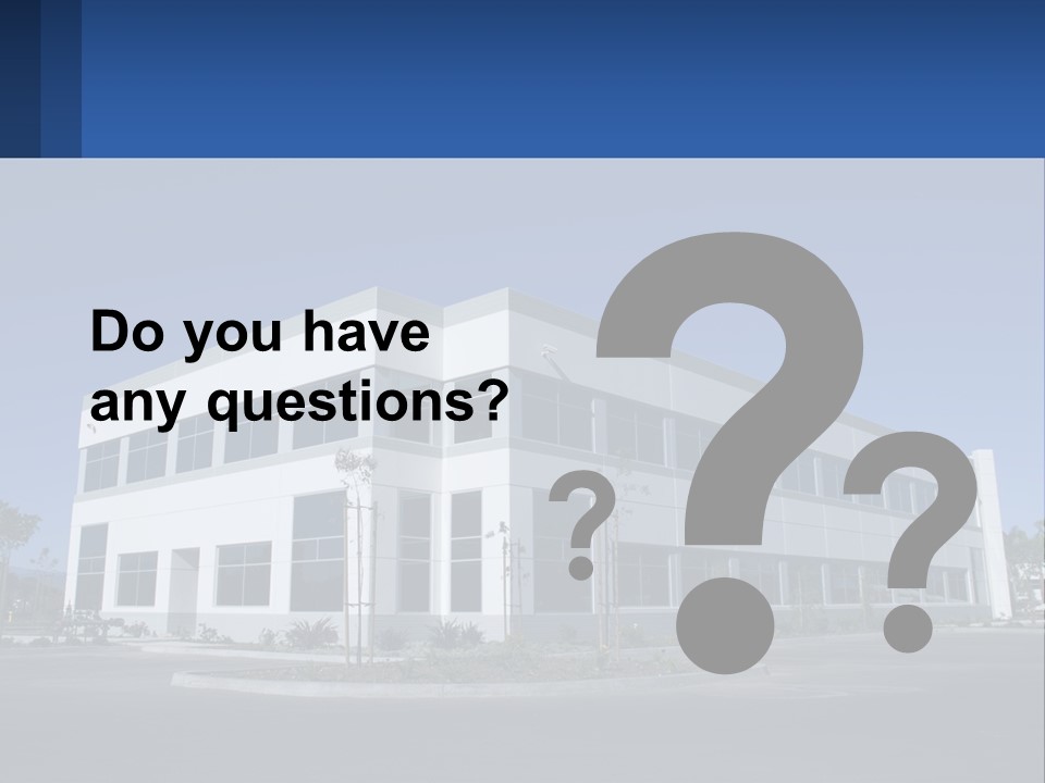 A Large White Building With A Blue Sign In Front Of It PowerPoint Template