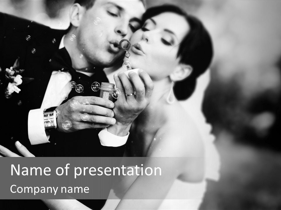 A Man And A Woman Kissing In A Black And White Photo PowerPoint Template