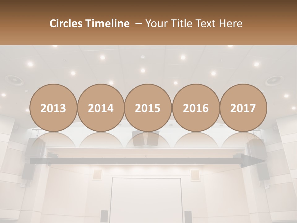 A Large Auditorium With Speakers And Lights On The Ceiling PowerPoint Template