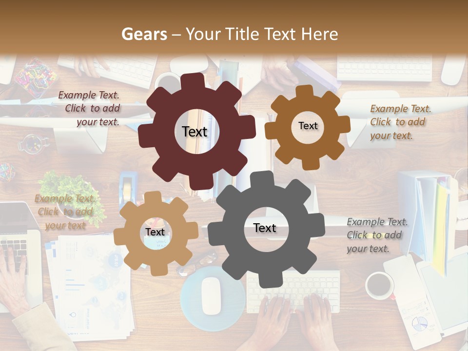 A Group Of People Sitting At A Table Working On Laptops PowerPoint Template