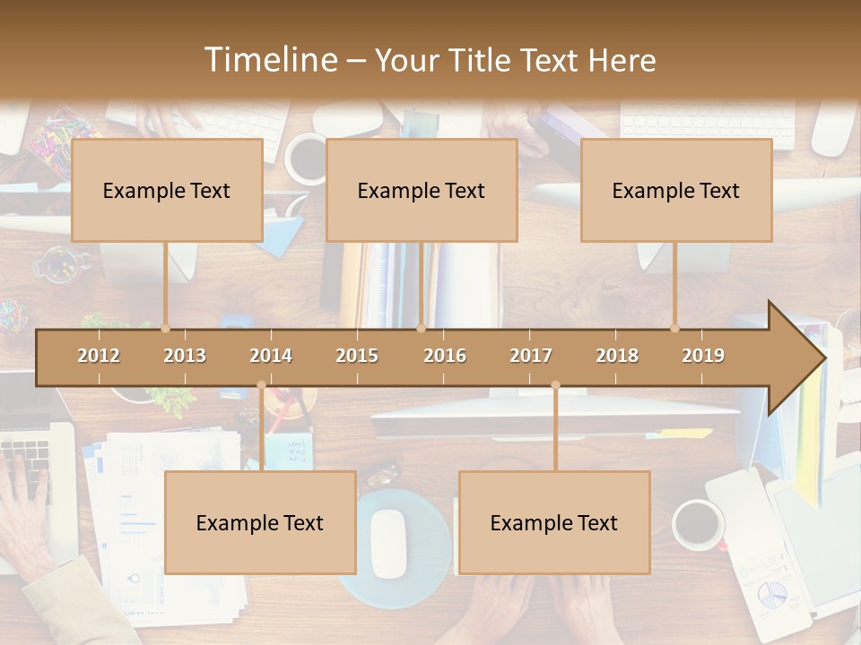 A Group Of People Sitting At A Table Working On Laptops PowerPoint Template