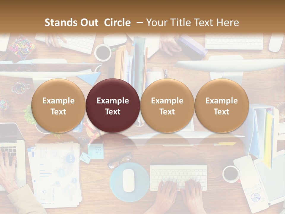 A Group Of People Sitting At A Table Working On Laptops PowerPoint Template