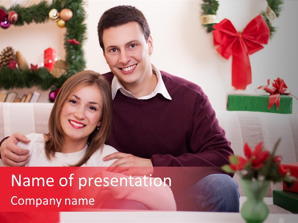 A Man And Woman Sitting On A Couch With Presents PowerPoint Template