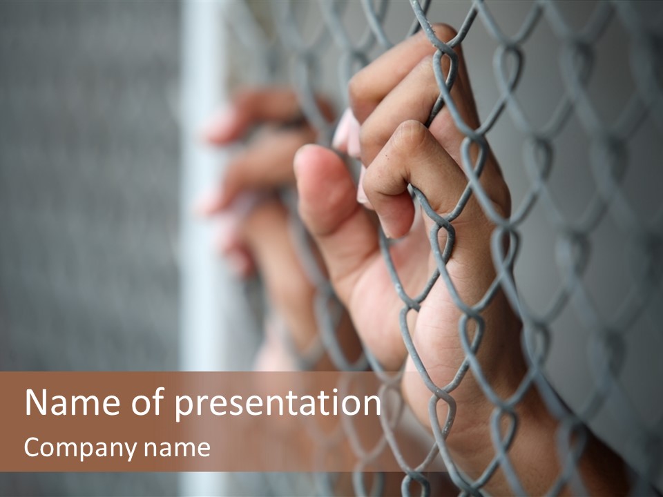 A Person Holding A Chain Link Fence With Their Hands PowerPoint Template