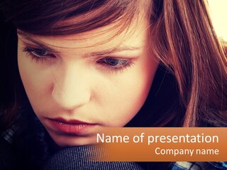 A Young Girl Is Looking Down At Her Tie PowerPoint Template