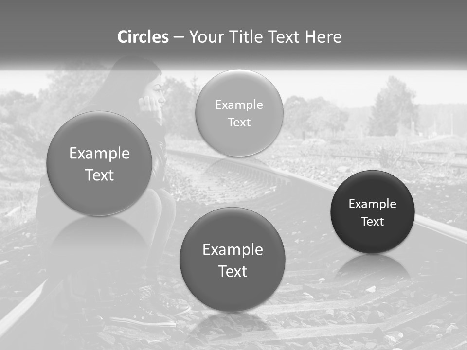 A Woman Sitting On A Train Track In Black And White PowerPoint Template