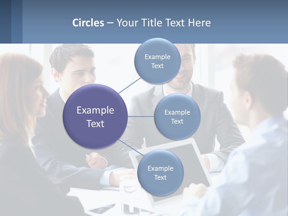 A Group Of Business People Sitting Around A Table PowerPoint Template