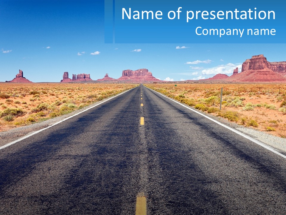 An Empty Road With A Blue Sky And Mountains In The Background PowerPoint Template
