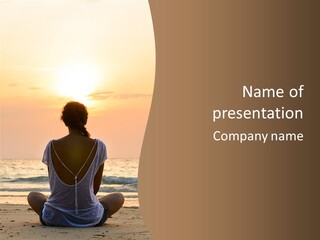 A Woman Sitting On The Beach At Sunset Powerpoint Template PowerPoint Template