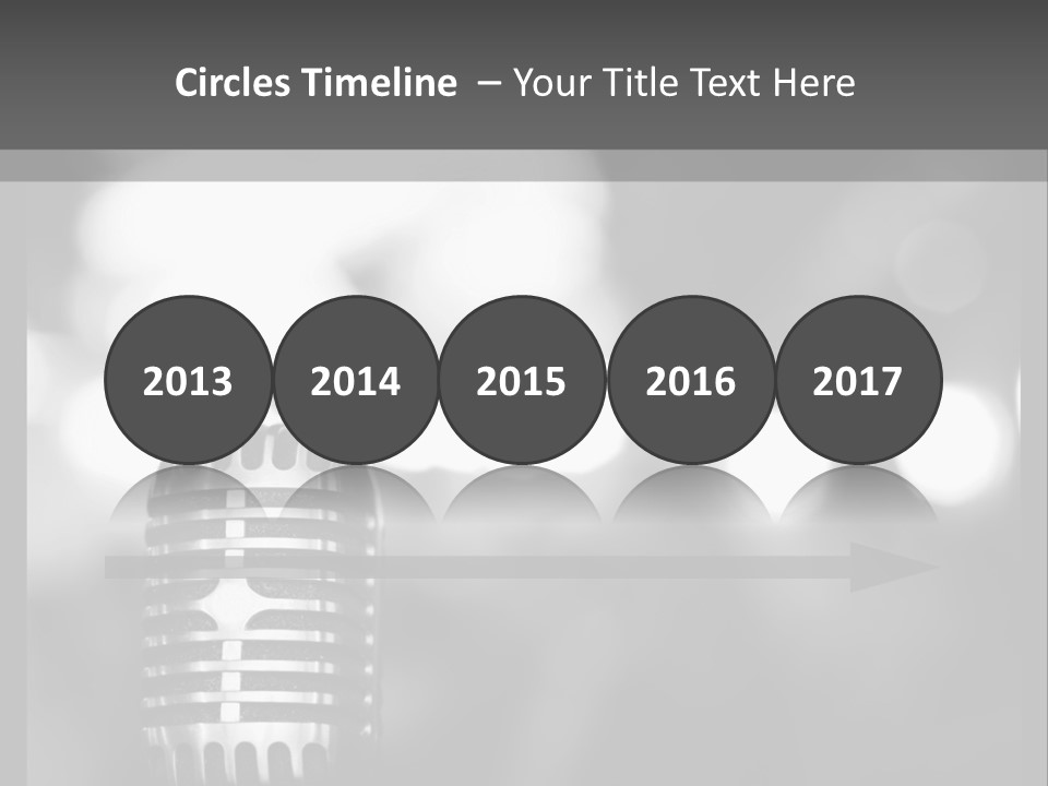 A Black And White Photo Of A Microphone PowerPoint Template