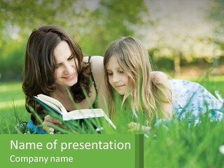 A Mother And Daughter Laying In The Grass Reading A Book PowerPoint Template