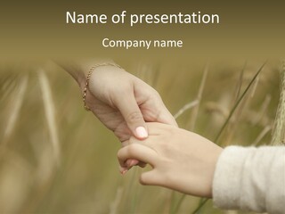 A Person Holding The Hand Of Another Person In A Field PowerPoint Template