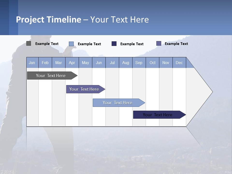 A Man Standing On Top Of A Mountain Pointing At Something PowerPoint Template