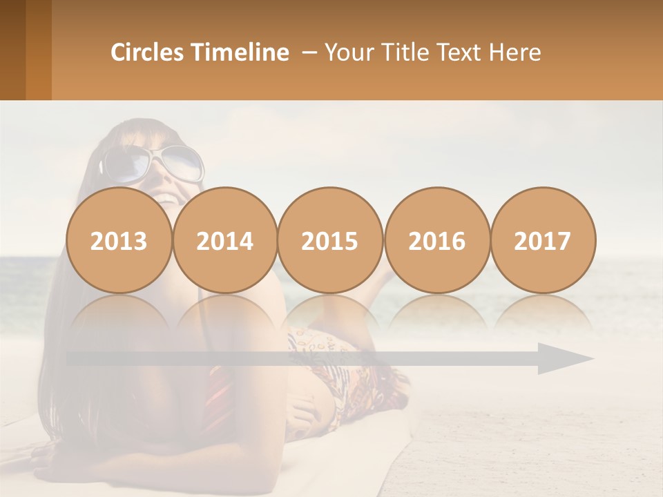 A Woman Laying On The Beach With Sunglasses On Her Head PowerPoint Template