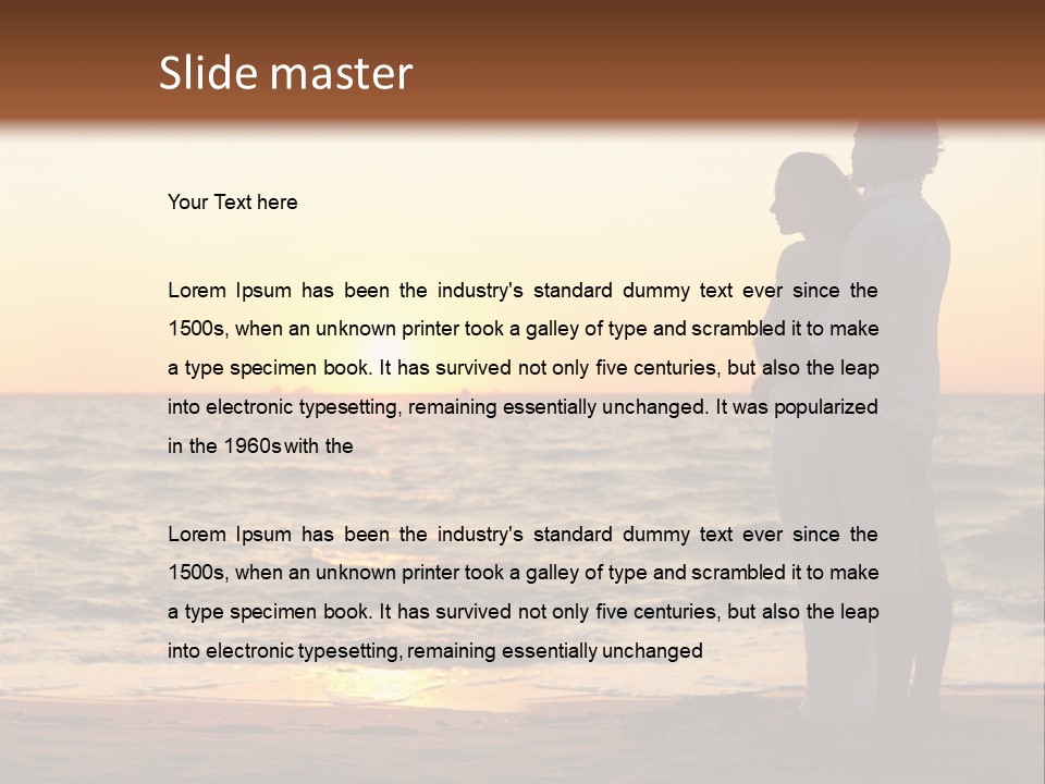 Two People Standing On A Beach At Sunset PowerPoint Template