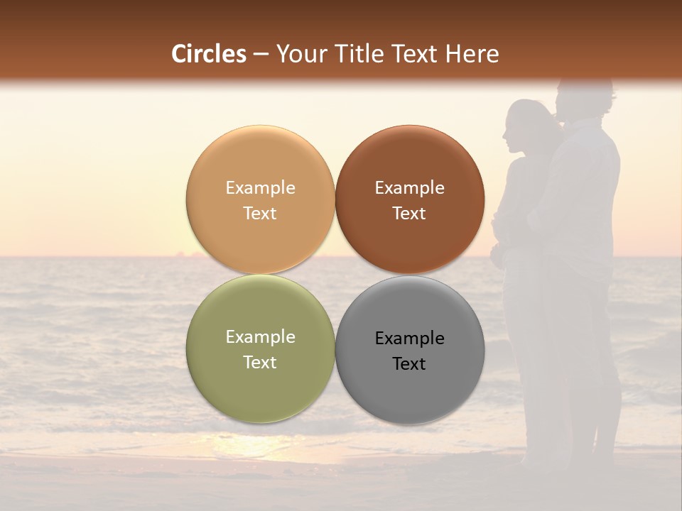 Two People Standing On A Beach At Sunset PowerPoint Template