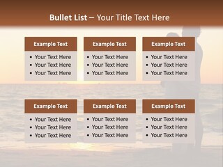 Two People Standing On A Beach At Sunset PowerPoint Template