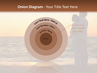 Two People Standing On A Beach At Sunset PowerPoint Template