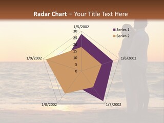 Two People Standing On A Beach At Sunset PowerPoint Template