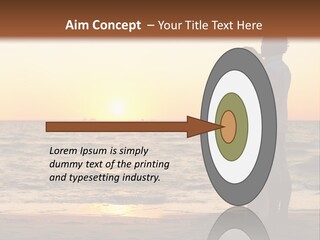 Two People Standing On A Beach At Sunset PowerPoint Template